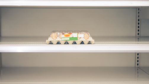 Empty shelves with single egg carton